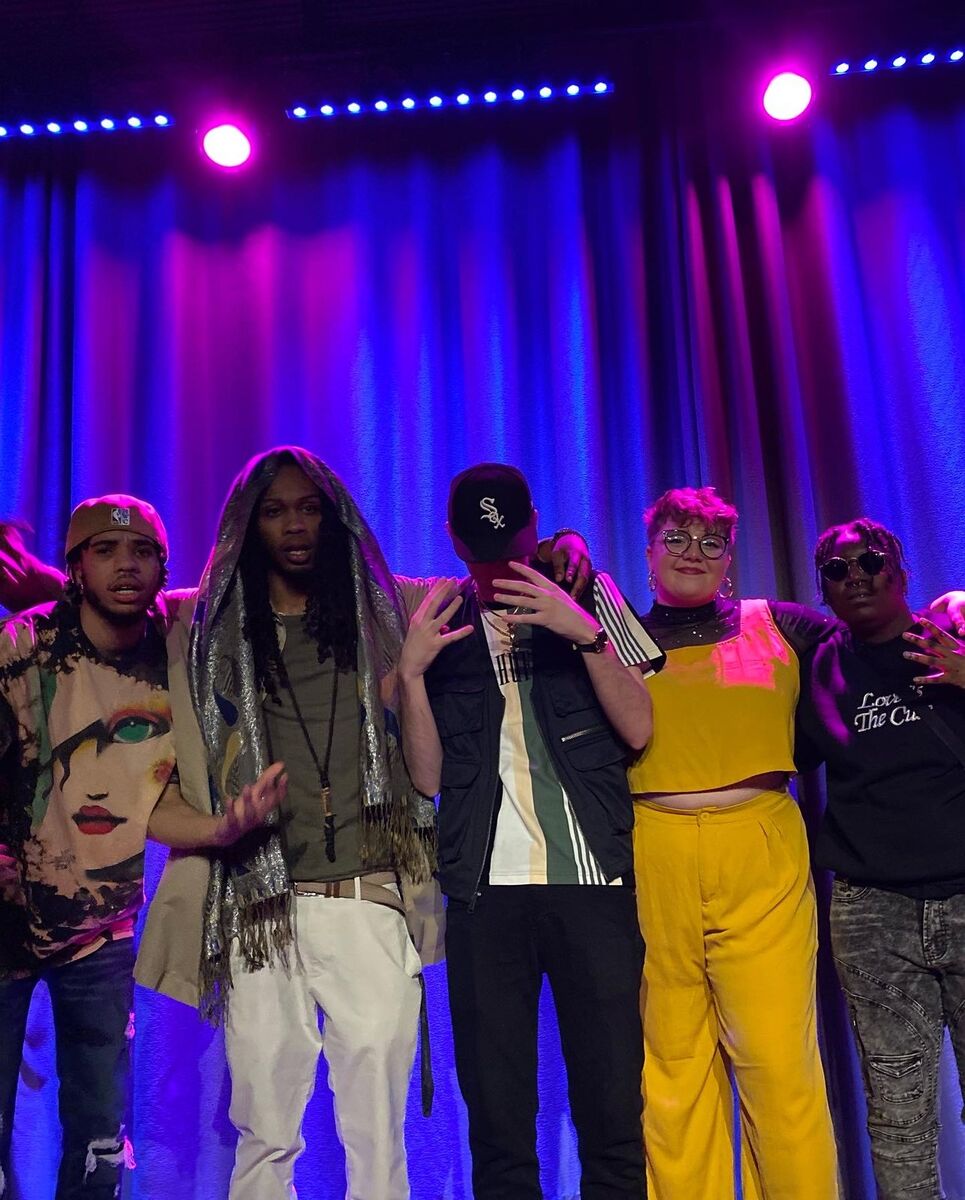 Kay Kay and community members together on stage at a Milwaukee event